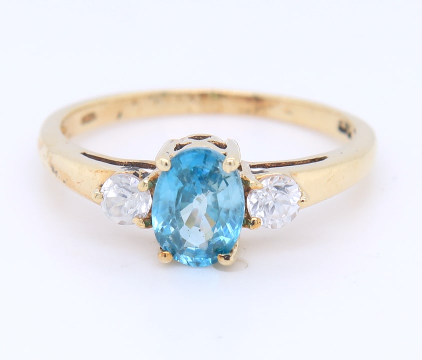 Blue Topaz and Spiel Cocktail Ring in Yellow Gold: Oval Blue Topaz and Spiel Cocktail Ring in 10kt Yellow Gold. Total weight of Ring 1.8 Grams. Ring Size 7"