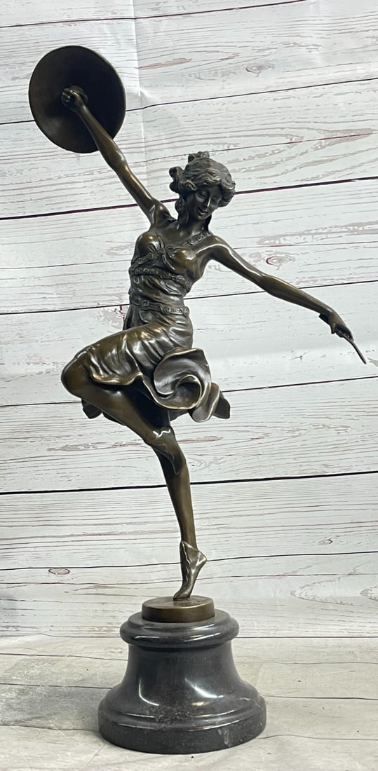 CLAIRE COLINET BRONZE DANCER STATUE: THE ARTIST IS LOVED AND HER WORKS SO APPRECIATED FOR THE POWERFUL SENSE OF MASTERING SPACE DEFINED BY HANDS AND LEGS, ESPECIALLY IN FORMS RELATED TO BALLET AND OTHER FORMS OF DANCE. cOSTUNES ARE INCRE