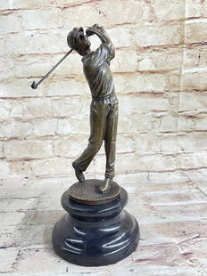 Bobby Jones Golfer Bronze Marble Statue Golf Club Golfing Trophy Sport Figurine: The golfer smiles as he has just completed a perfect swing. He watches as his ball sinks into the hole. This golfer is dressed sharply in a polo and crisp pants. His outfit is topped off with cap.