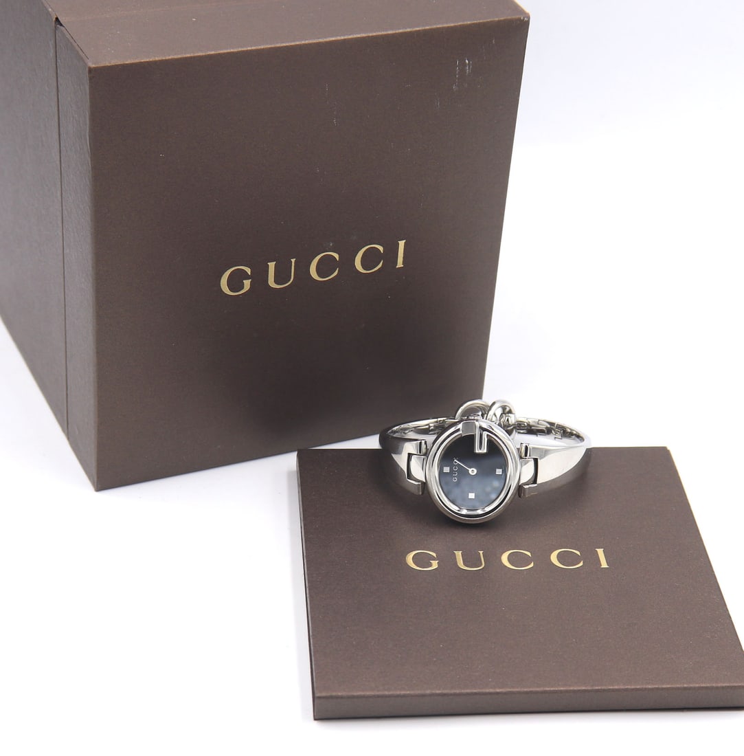 Gucci Guccissima quartz black dial watch: Gucci Guccissima quartz black dial ladies stainless steel 6.5 inches watch. Total weight of watch 44 grams. Comes with Inner and outer box and booklet.