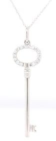 14kt White gold diamond accent key pendant on chain