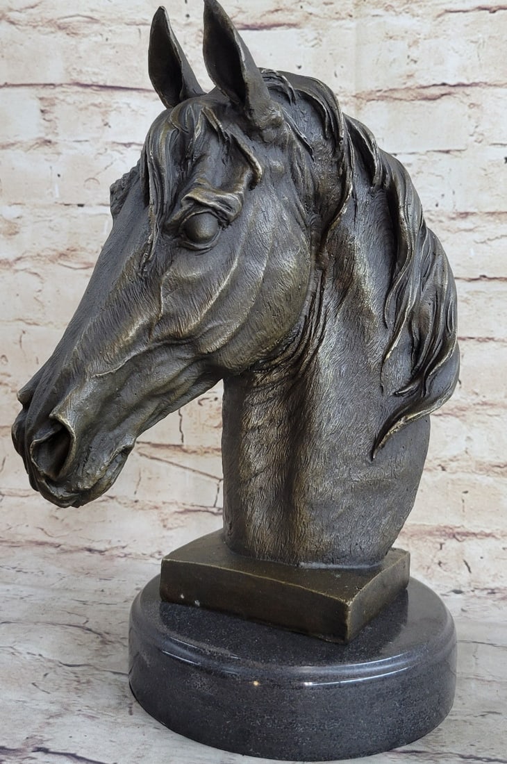 Horse Bust Bronze Sculpture: This gorgeous bronze bust of a horse is filled with a raging vibe of energy. The horse seems to be excited or spooked. He bends his head down towards his body as his hair flows upwards as if he is buc