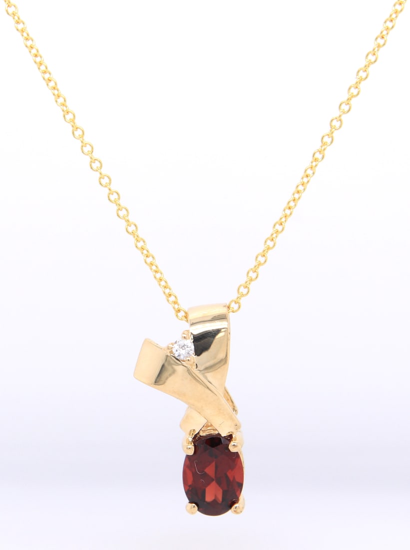 Fantastic Yellow Gold oval Garnet and Diamond Pendant on Chain: Fantastic 14kt Yellow Gold approximate 1ct oval Garnet and Diamond Pendant on 18 inches Chain Necklace. Total weight of Necklace 2.60 Grams.