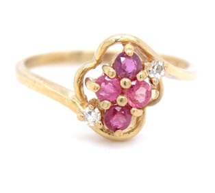 10kt Yellow gold ruby and diamond flower style ring