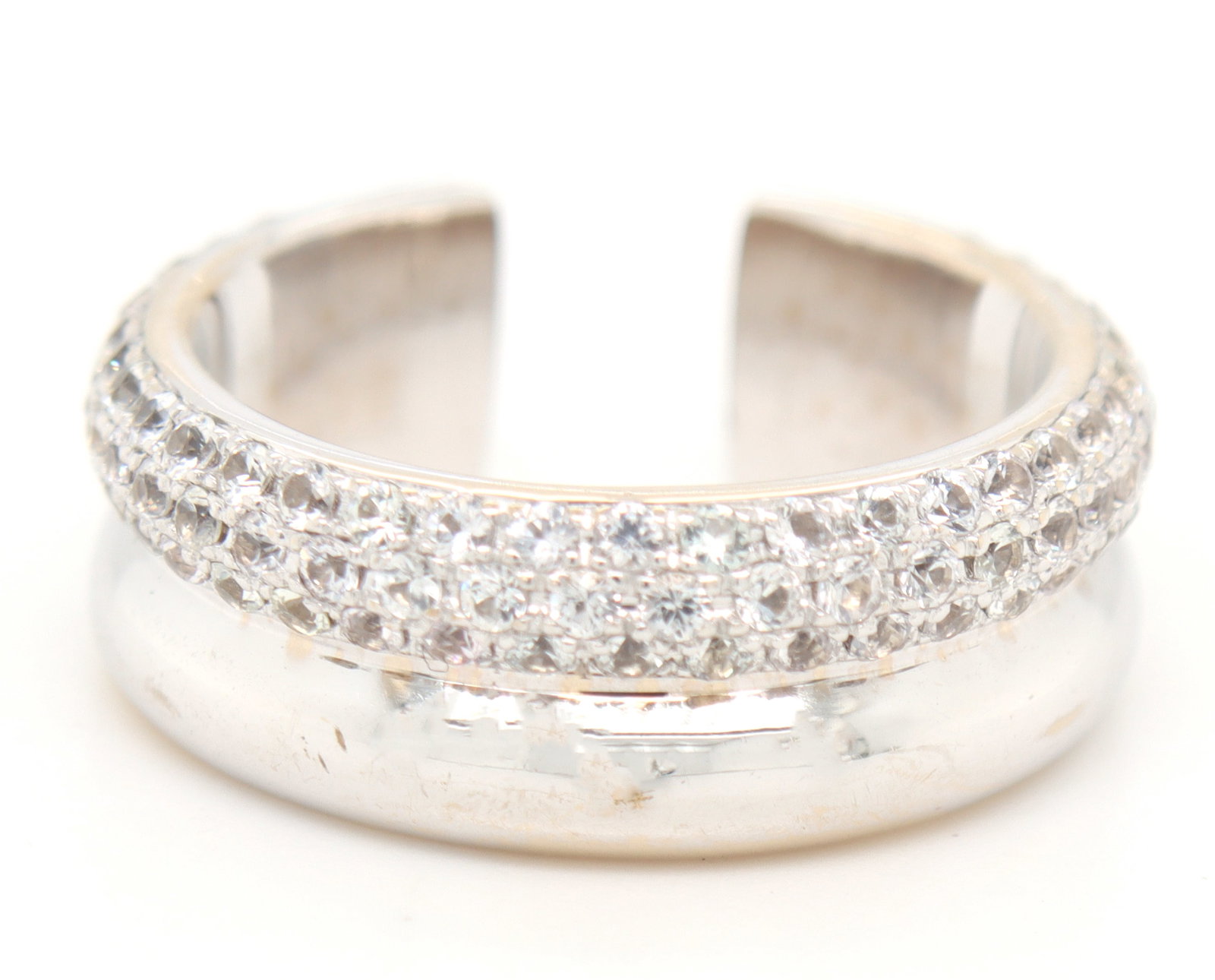 18kt White gold white sapphire Pave C shape ring: 18kt White gold white sapphire pave C shaped ring. Total weight of ring is 7.7 grams. Ring size 8.5".