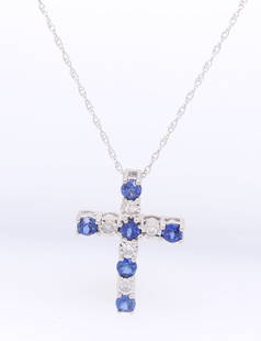 Fantastic White Gold Sapphire and Diamond accent Cross Pendant on Chain: Fantastic 10kt White Gold approximate 0.80ctw Blue Sapphire and Diamond accent Cross Pendant on 18 inches Chain Necklace. Total weight of Necklace 2.20 Grams.