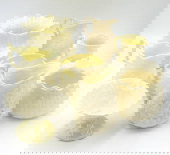 Group lot of 8 Belleek Ivy yellow mini creamer and bowls: Group lot of 8 Vintage Irish Belleek Ivy signed yellow mini creamer and bowls.