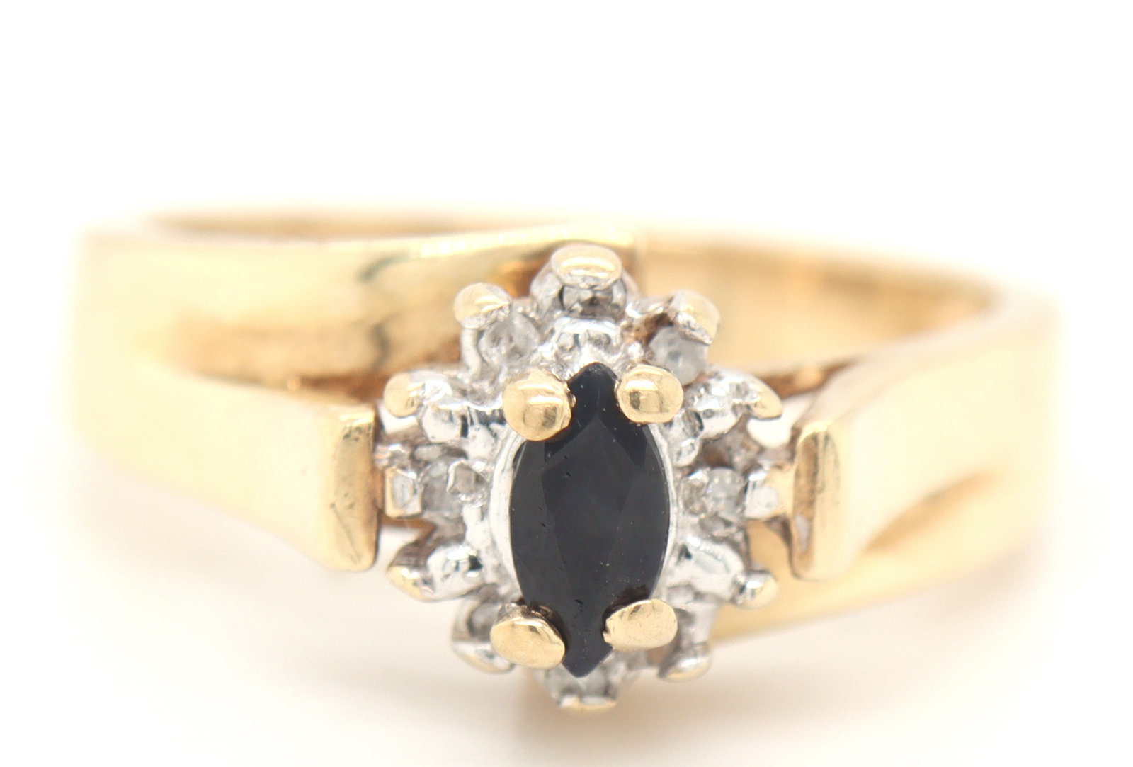 10kt Yellow gold blue sapphire and diamond ring: 10kt Yellow gold blue sapphire and diamond ring. Total weight of ring is 3.6 grams. Ring size 6.5"