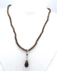 Pear shaped smokey quartz pendant on beaded necklace