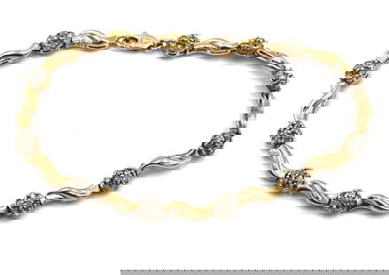 10kt Yellow gold diamond flower link bracelet: 10kt Yellow gold diamond flower link 7-inch bracelet with lobster clasp. The total weight of the bracelet is 6.9 grams..