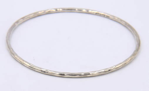 Stylish Sterling Silver Ippolita Hammered Bangle: This Stylish 925 Sterling Silver Bangle designed by Ippolita features Hammered silver for a stackable addition to any bracelet stack. This bracelet weighs approx. 8.70 Grams.