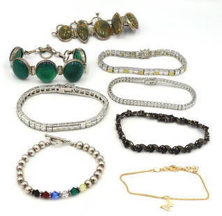Group lot of 8 Vintage 925 sterling silver bracelets: Group lot of 8 Vintage 925 sterling silver cubic zirconia and Jade bracelets. Total weight of lot is 98.5 grams.