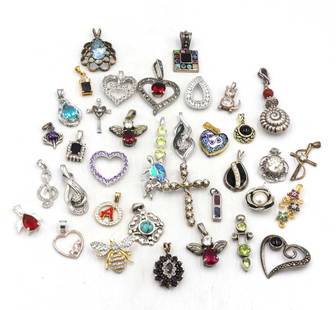 Group lot of Vintage 925 sterling silver pendants and charms: Group lot of Vintage 925 sterling silver pendants and charms. Total weight of lot is 89.3 grams.