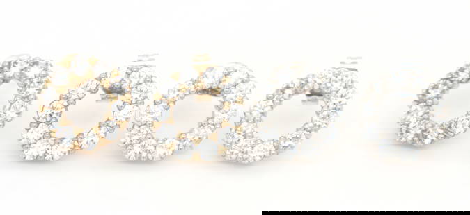 2 Pairs of 14kt gold Cubic Zirconia round earrings: 2 Pairs of 14kt yellow and white gold Cubic Zirconia round earrings. Total weight of lot is 2.4 grams.