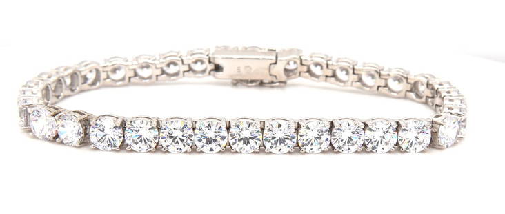 925 Sterling silver cubic zirconia tennis bracelet: 925 Sterling silver cubic zirconia 7.25 inches tennis bracelet. Total weight of bracelet is 19.20 grams.Silver
