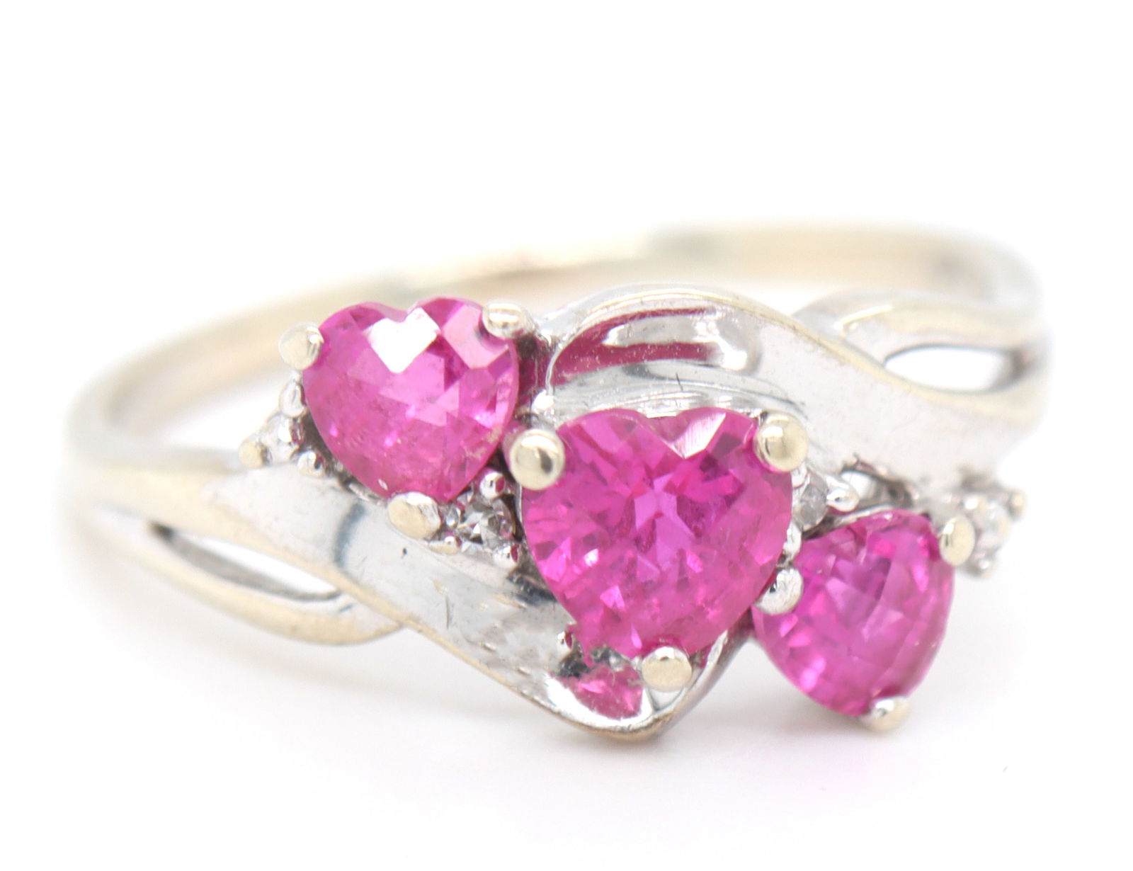 10kt White gold pink topaz 3 heart shaped ring: 10kt White gold pink topaz 3 heart shaped ring. Total weight of ring is 2.7 grams. Ring size 8".