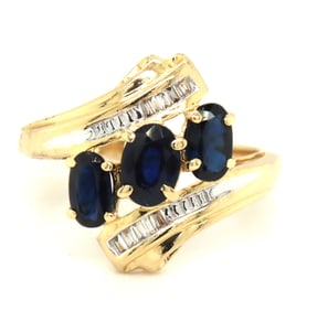 14kt Yellow gold 3 oval sapphire and baguette crossover ring