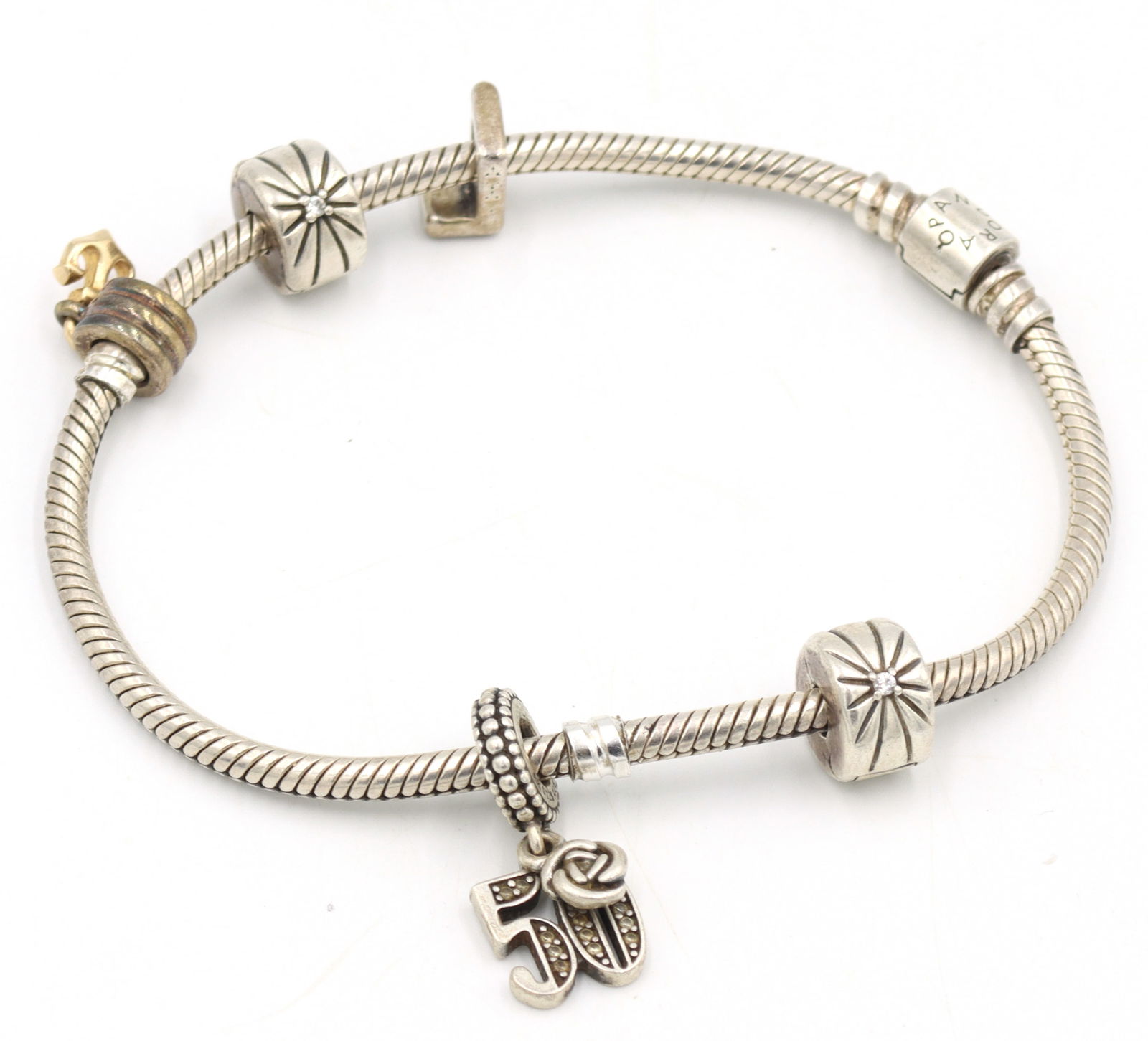 925 Sterling silver Pandora bracelet with charms: 925 Sterling silver Pandora 7.5 inches bracelet with charms. Total weight of bracelet is 25.3 grams.