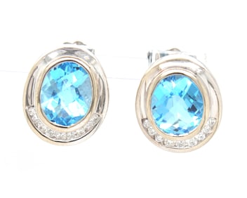 14kt White gold bezel set oval topaz and diamond half halo stud earrings