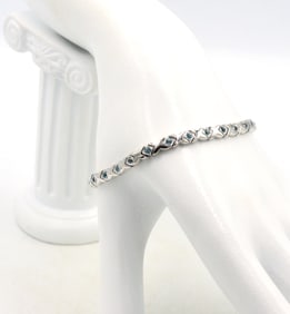 14kt White gold blue topaz X link bracelet