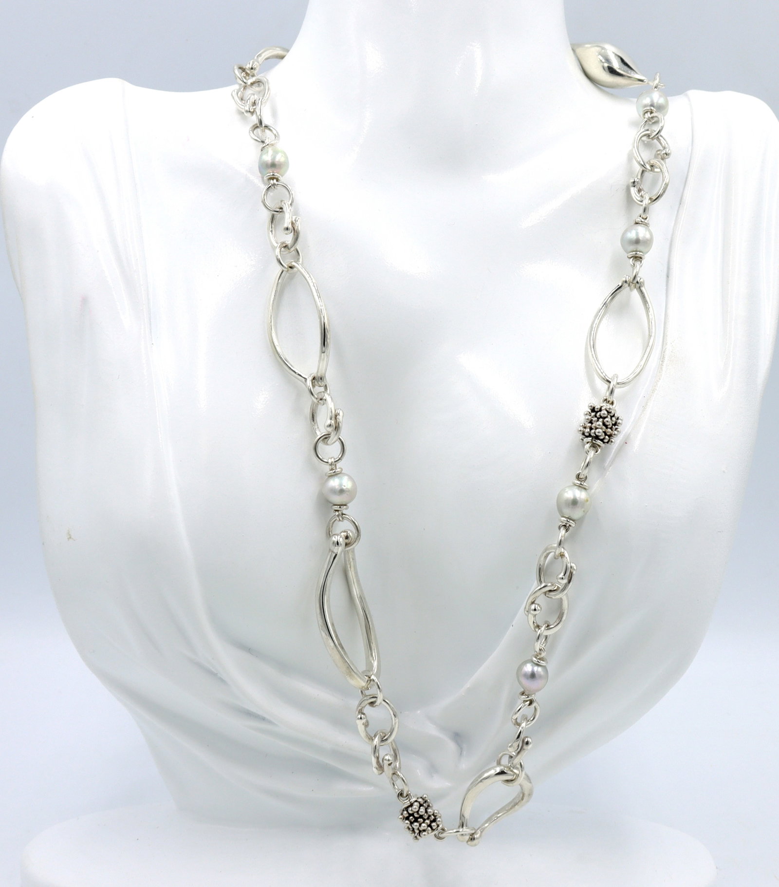 Michael Dawkins pearl necklace in 925 sterling silver: Michael Dawkins pearl 20-inch necklace in 925 sterling silver. The total weight of necklace is 55.40 grams.