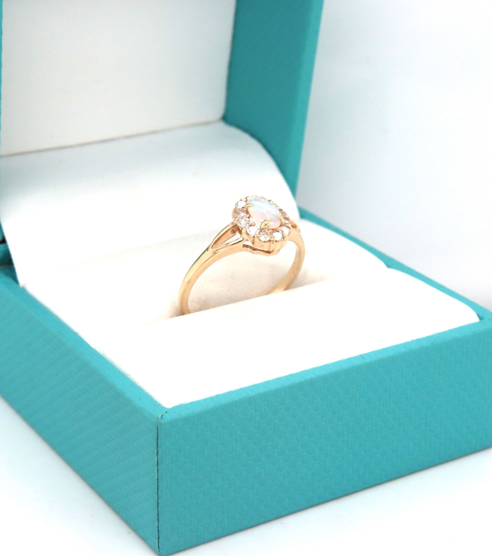 14kt Yellow gold oval opal and diamond halo ring (1 of 3)