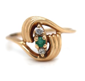 14kt Yellow gold emerald and diamond bypass ring