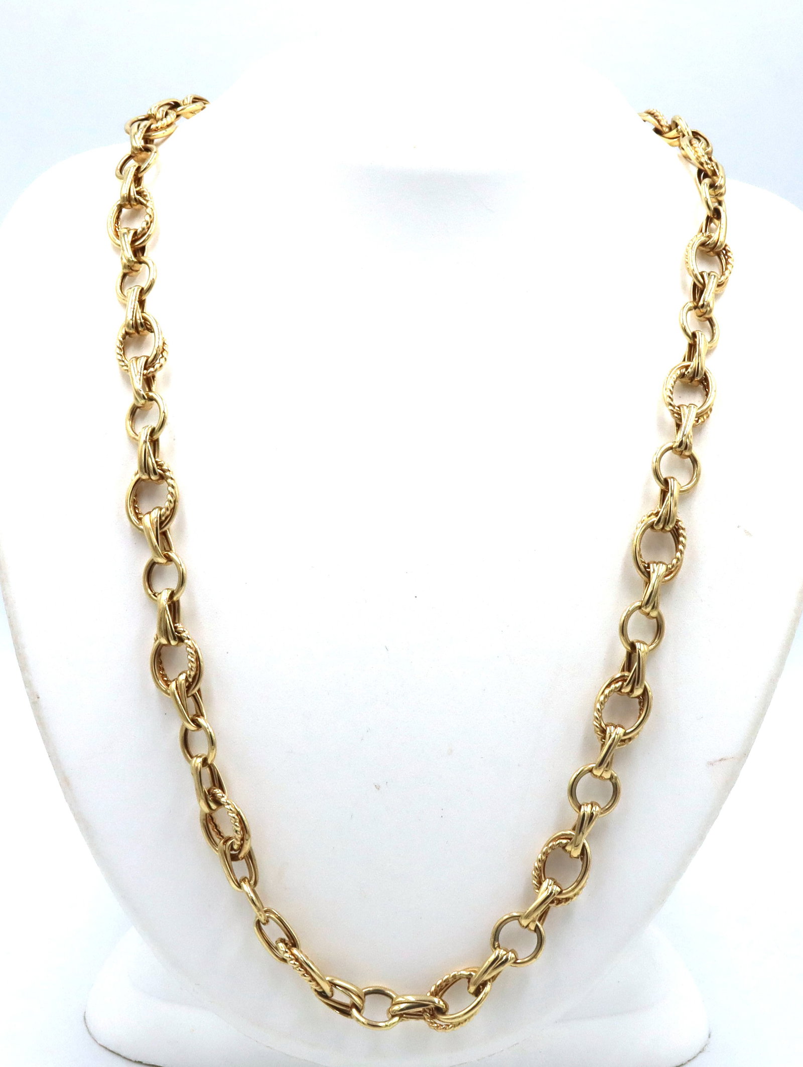 14kt Yellow gold double oval link chain necklace: 14kt Yellow gold double oval link 28-inch chain necklace. The total weight of the necklace is 29 grams.