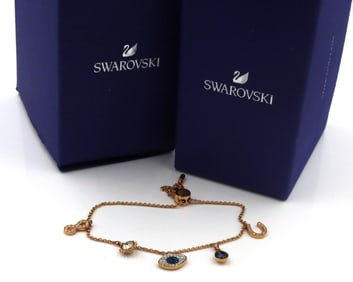 Swarovski evil eye and horseshoe clover blue gold tone bracelet