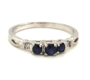 10kt White gold 3 stone sapphire and diamond accent ring