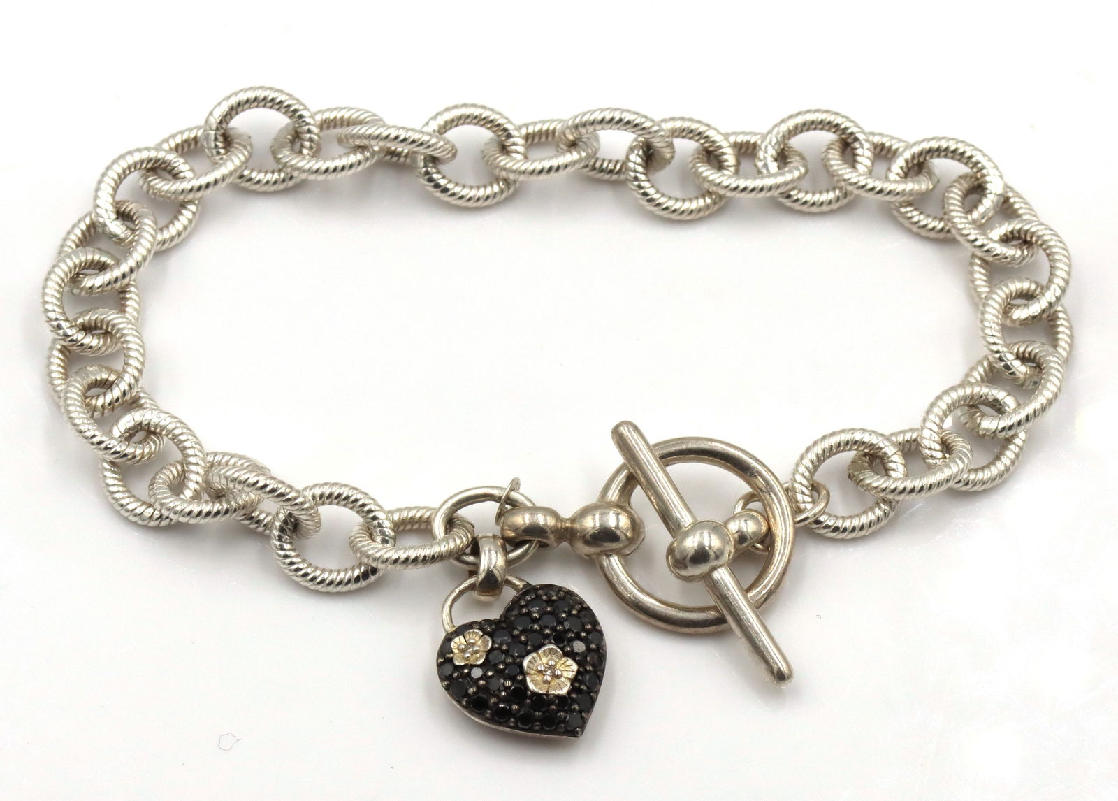 925 Sterling Silver Stephen Dweck Black Diamond Charm Bracelet: 925 sterling silver Stephen Dweck black diamond heart charm bracelet with toggle. 22.2Grams