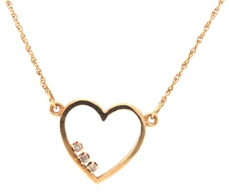 14kt Yellow gold heart shaped 3 stone diamond pendant on chain