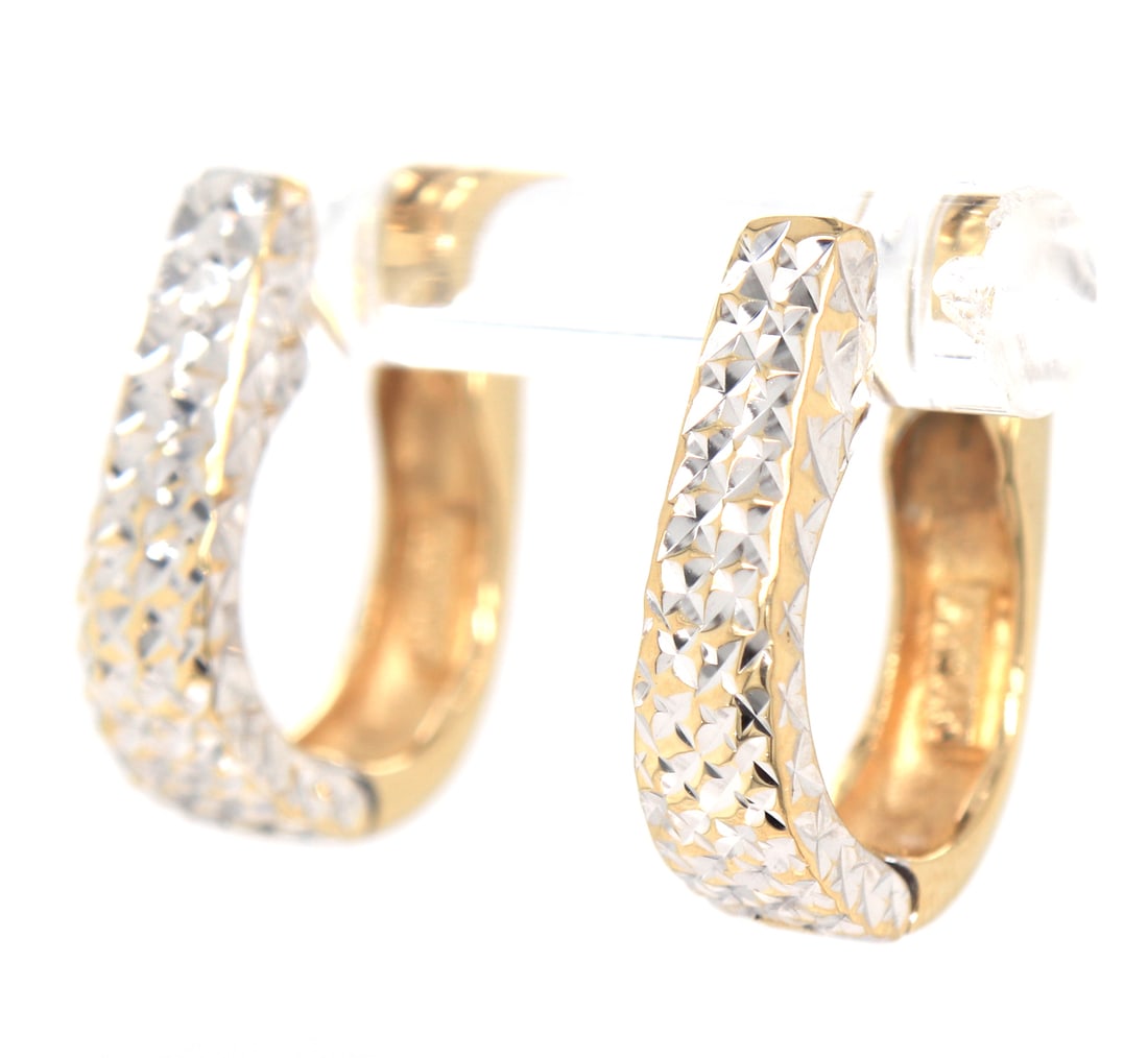 14kt two tone reversible oval hoop: 14kt two tone reversible oval hoop. Total weight of earrings is 3.51 grams.