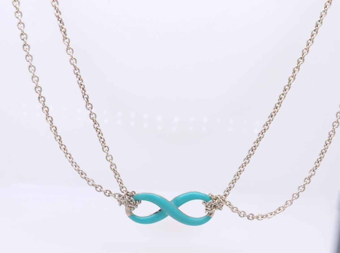 Tiffany & Co Infinity Blue Enamel Necklace: 925 Sterling Silver Tiffany & Co Infinity Blue Enamel Necklace. Total weight of Necklace 5.70 Grams.