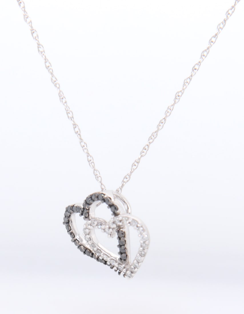 Sparkling White Gold Black and White Diamond Double Heart Pendant on Chain: Sparkling 10kt White Gold Black and White Diamond Double Heart Pendant on 18 inches Chain Necklace. Total weight of Necklace 1.20 Grams.