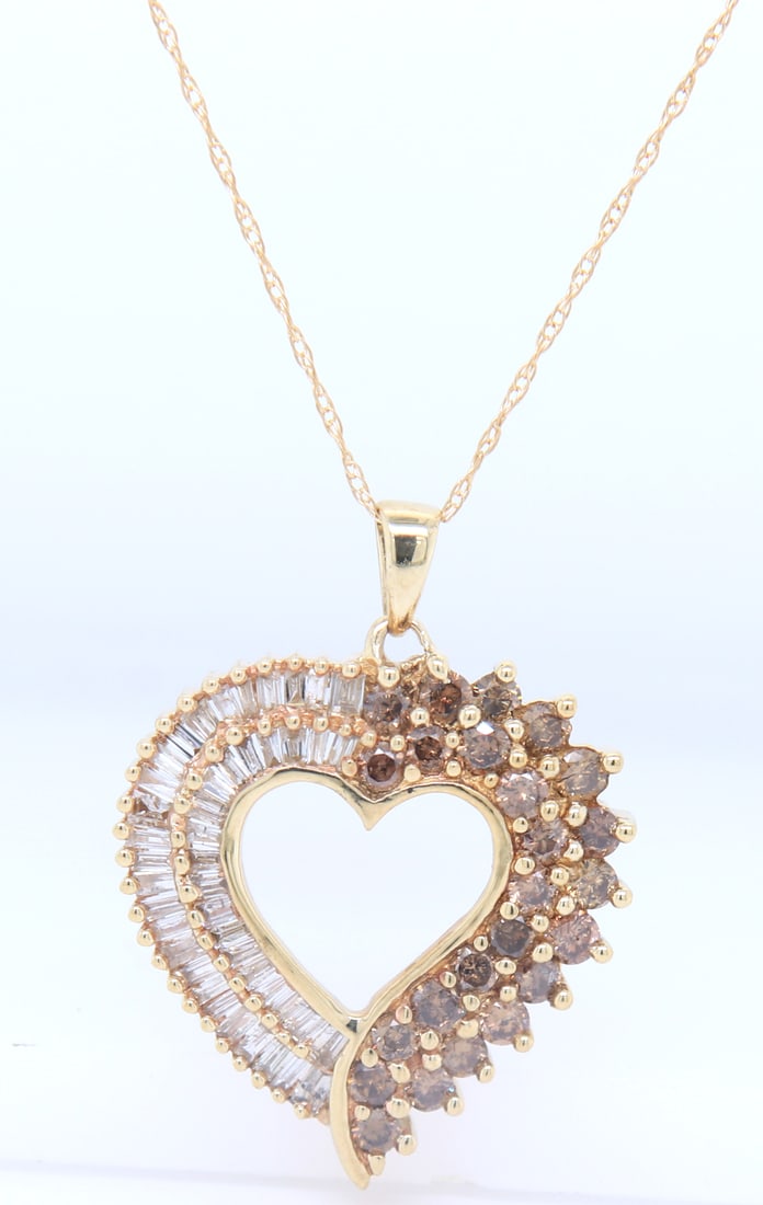 Fabulous Yellow Gold Chocolate and White Diamond Heart Shaped Pendant on Chain: Fabulous 10kt Yellow Gold approximate 0.90ctw Chocolate and White Diamond Heart Shaped Pendant on 20 inches Chain Necklace. Total weight of Necklace 2.85 Grams.