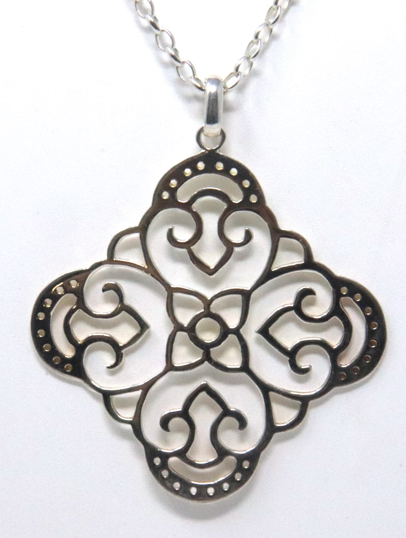 Sterling Silver Pendant on Chain Necklace: 925 Sterling Silver Pendant on 24 inches Chain Necklace. Total weight of Necklace 16.39 Grams.