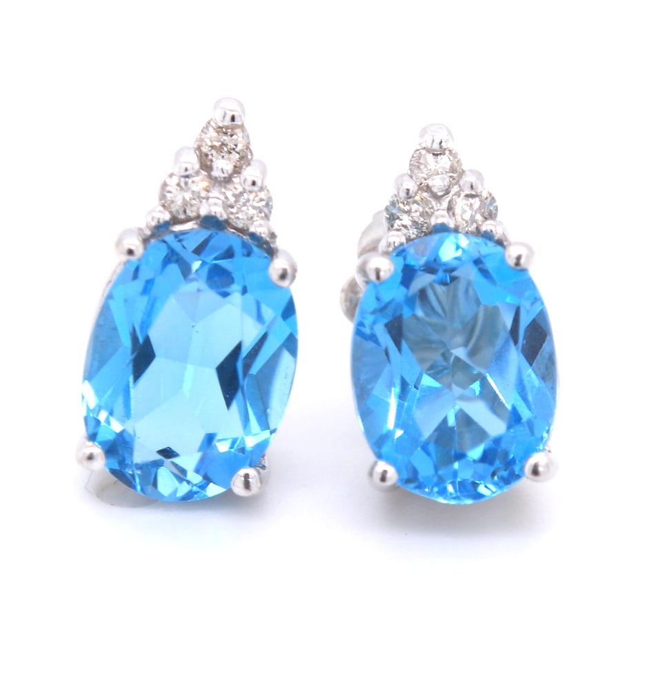 14kt White gold 3.60ctw Blue topaz and diamond accent earrings: 14kt White gold approximate 3.60ctw Blue topaz and diamond accent earrings. Total weight of earrings 2.44 grams.
