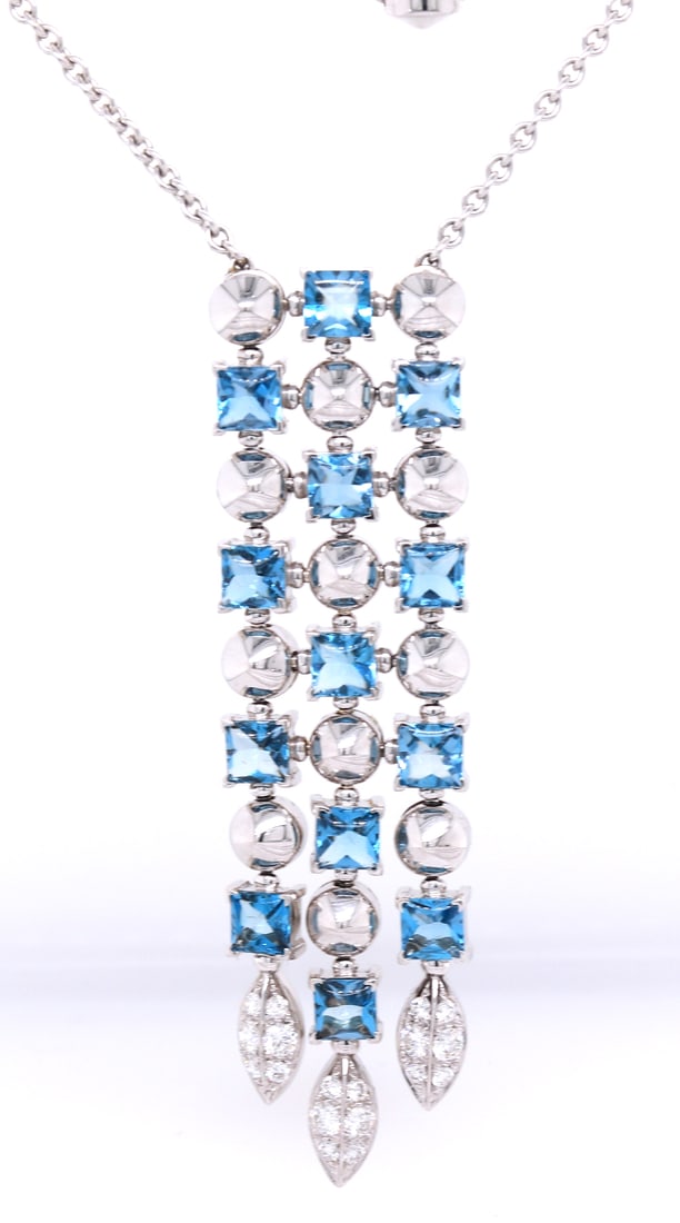 Bvlgari 3 row Drop necklace 18kt with blue topaz and diamonds: Bvlgari 3 row Drop adjustable necklace 18kt white gold with blue topaz and diamonds. Total weight of necklace 21.40 grams.