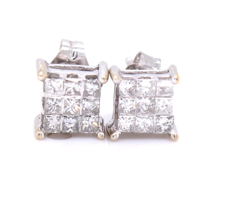 14kt White gold approximate 0.40ctw Invisible set diamond stud earrings: 14kt White gold approximate 0.40ctw Invisible set diamond stud earrings. Color I-J. Clarity I1. Total weight of earrings 1 grams.