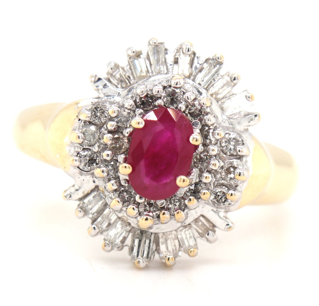14kt Yellow gold ruby and diamond cluster ring: 14kt Yellow gold ruby and diamond cluster ring. Total weight of ring is 4.50 grams. Ring size 8.75"