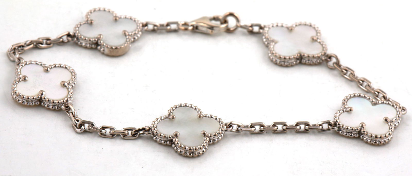 Vintage Alhambra 5 Motifs mother of pearl bracelet: Vintage Alhambra 5 Motifs mother of pearl 7-inch bracelet in 18kt White gold. Total weight of bracelet is 11.3 grams.