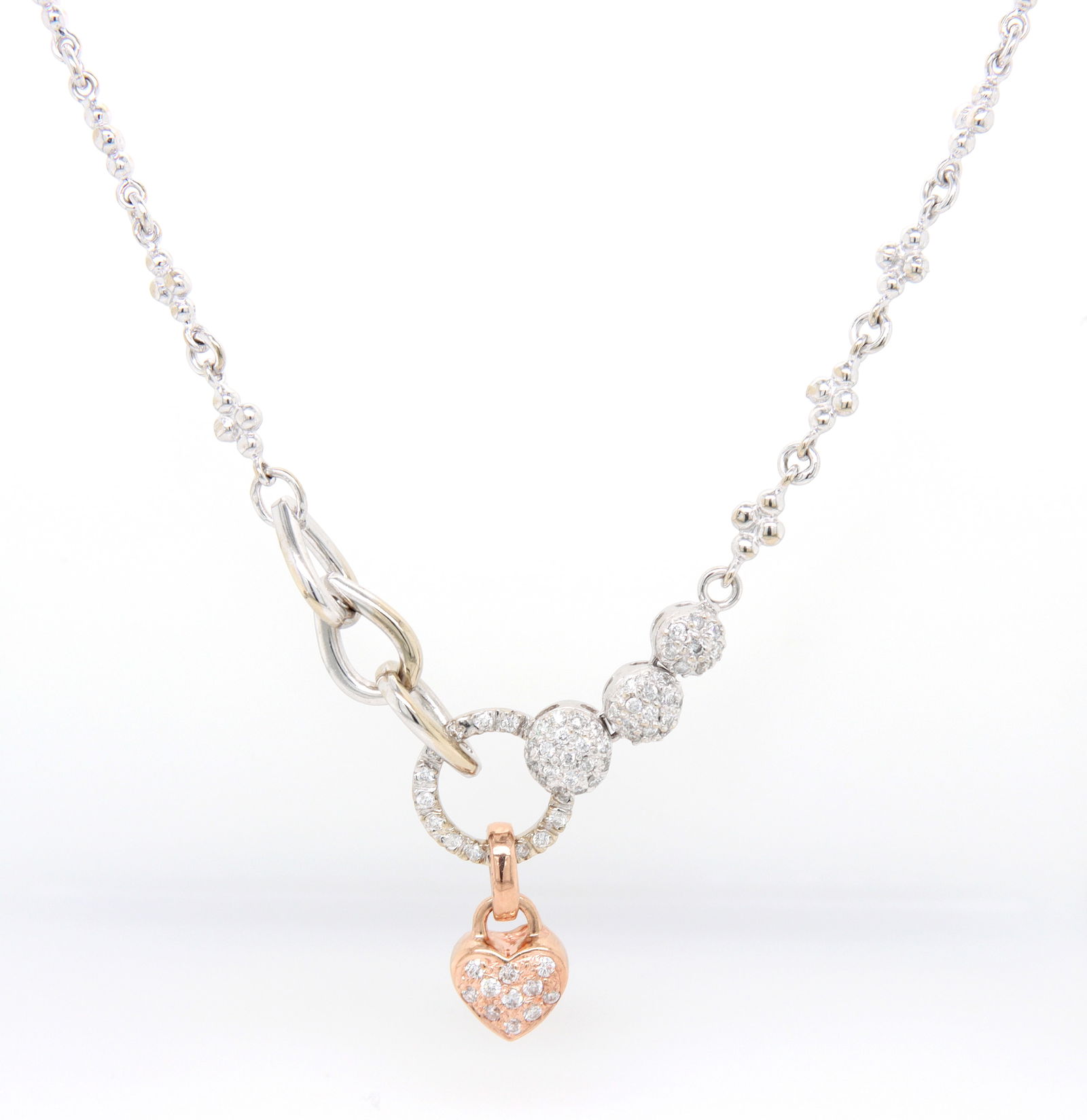 14kt White gold pave diamond station necklace: 14kt White gold approximate 0.55ctw pave diamond station and heart 18 inches necklace. Color G, Clarity VS. Total weight of necklace 18.20 grams.