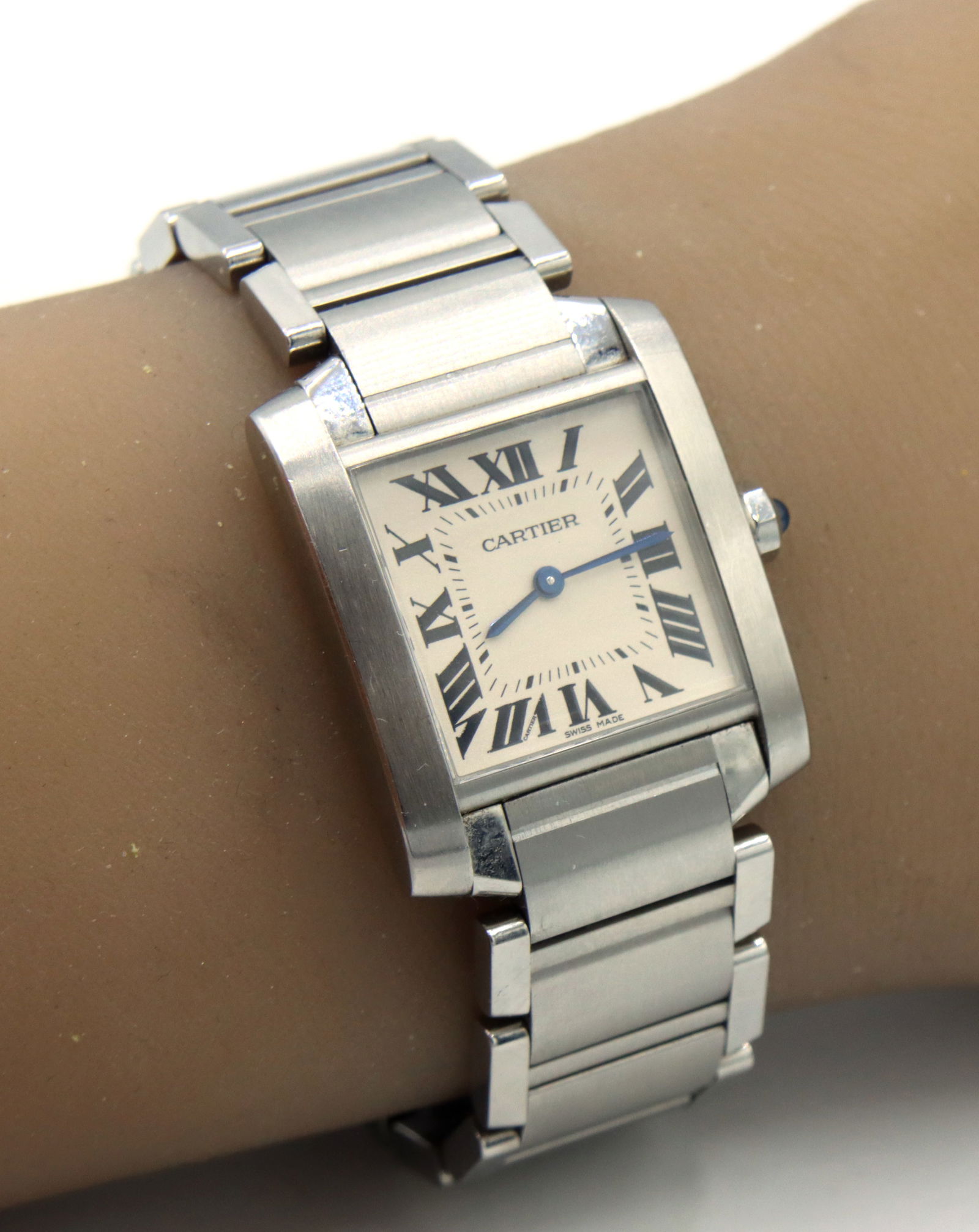 Cartier Tank Fan aise SM stainless steel ladies watch: Authentic pre-owned Cartier Tank Fan aise SM stainless steel ladies 6.5-inch watch. The total weight of the watch is 77.2 grams.