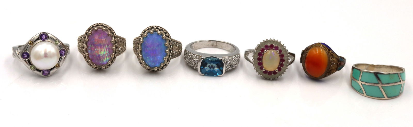 925 Sterling Silver Rings Lot: One Lot include 925 sterling silver seven multi color gemstone and pearl rings. 43.9 grams