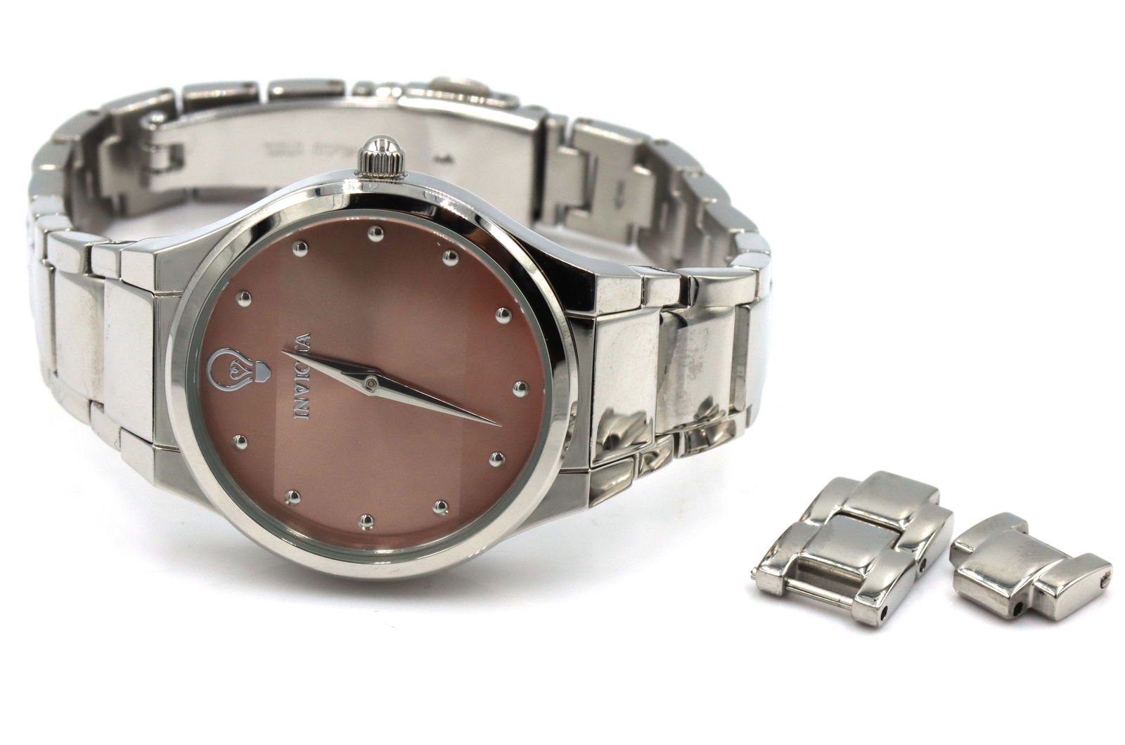 Invicta Gabrielle union quartz Sunray watch: Invicta Gabrielle union quartz Sunray stainless steel 7-inch watch. Comes with extra link. The total weight of the watch is 62.2 grams.