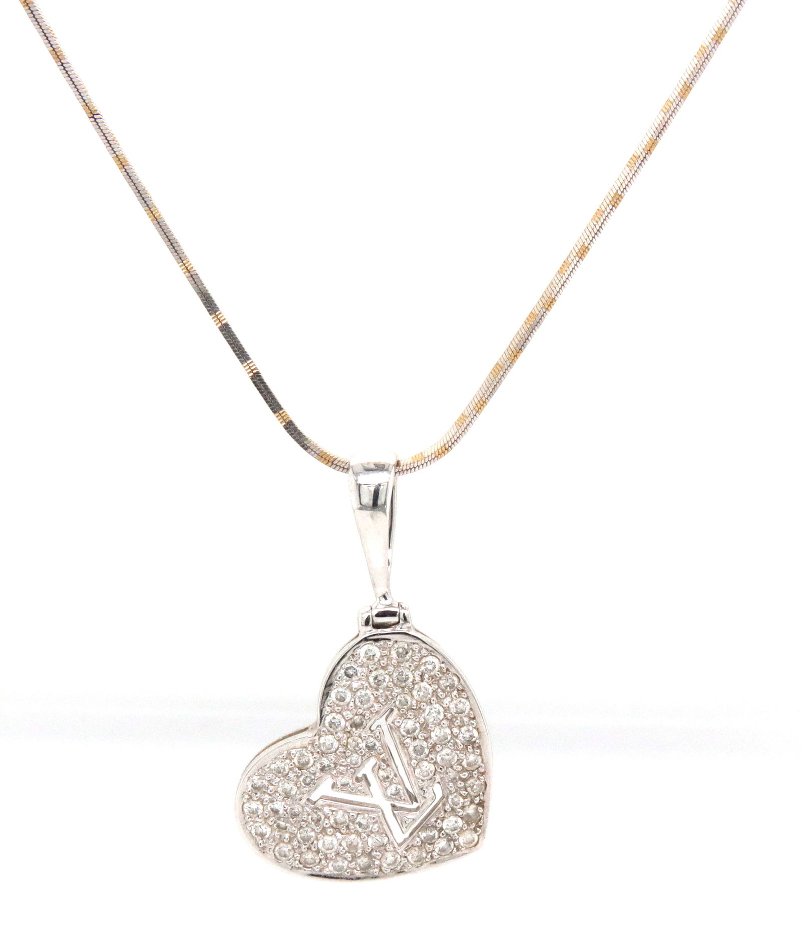18kt White gold LV diamond heart shaped pendant on Italian chain necklace: 18kt White gold LV diamond heart shaped pendant on 16-inch Italian chain necklace with spring ring clasp. The total weight of the necklace is 6.9 grams.