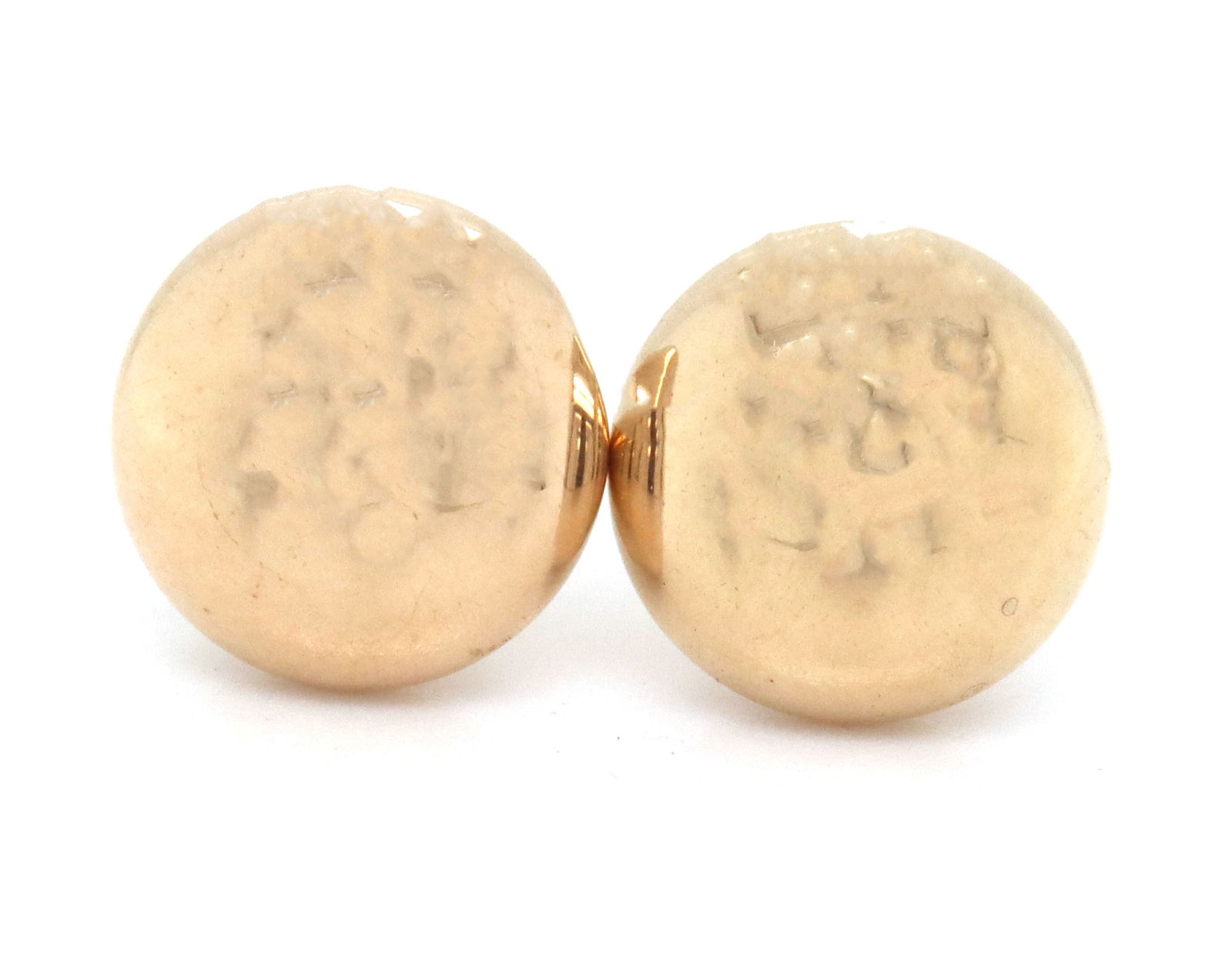 14KT Yellow gold button stud earrings: 14KT Yellow gold button stud earrings. The total weight of the earrings is 0.55 grams.