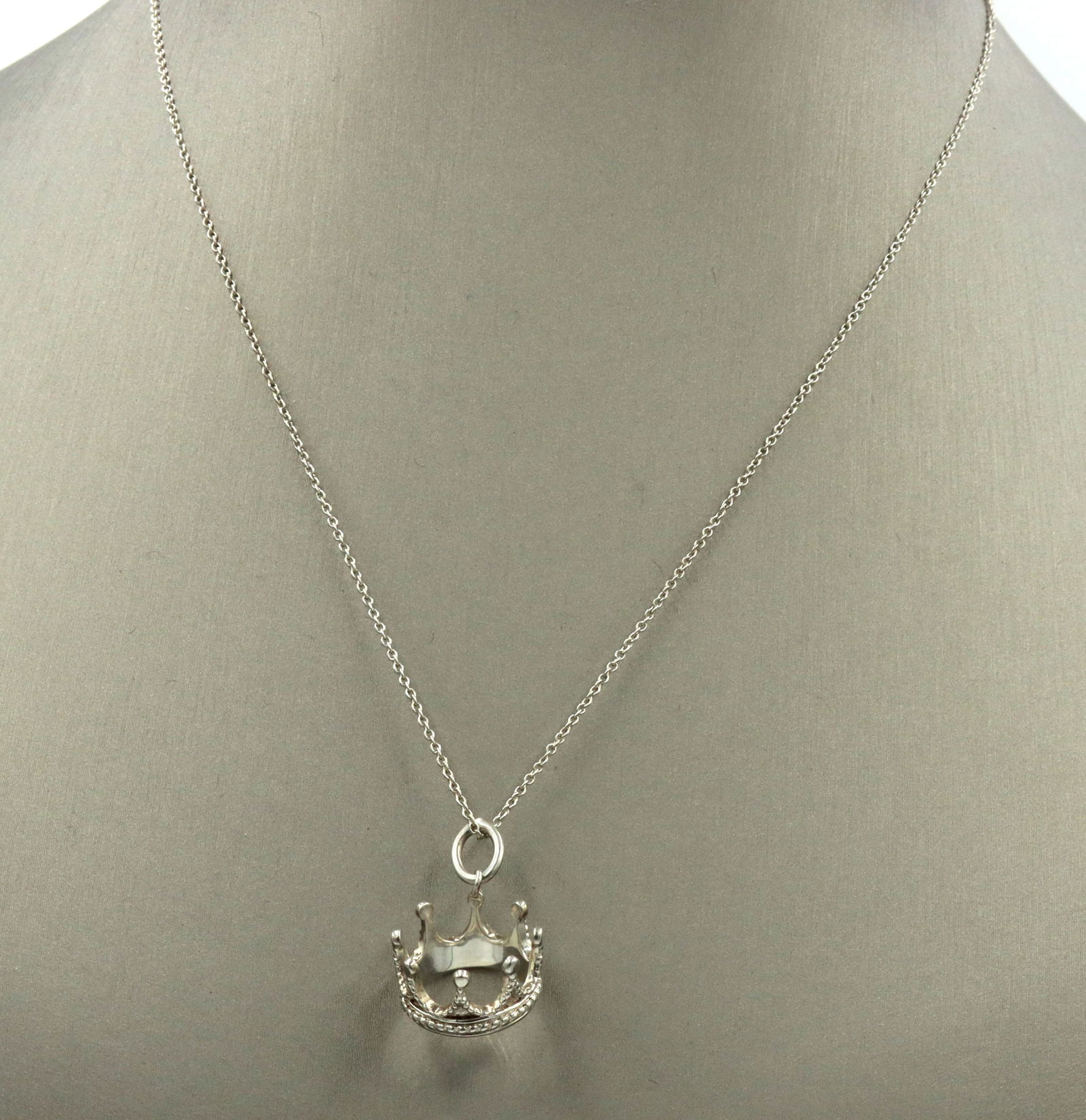 Tiffany & Co Crown charm necklace: 925 Sterling silver Tiffany & Co Crown charm pendant on 16 inches chain necklace. Total weight of necklace is 3.60 grams.