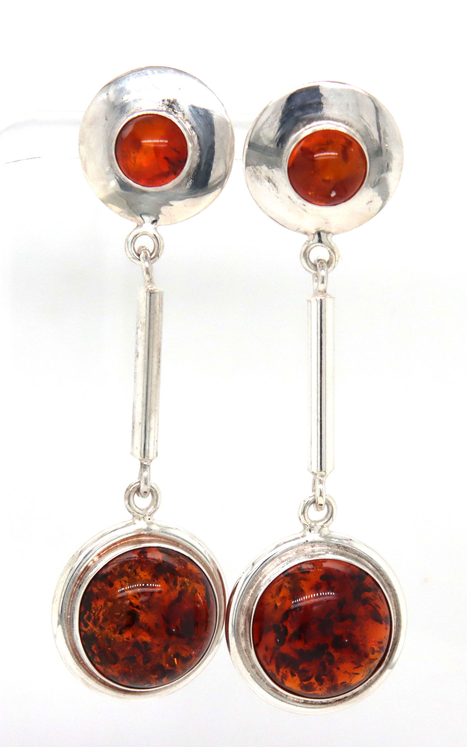 925 Sterling silver Amber dangle earrings: 925 Sterling silver Amber dangle earrings. The total weight of the earrings is 9.72 grams.